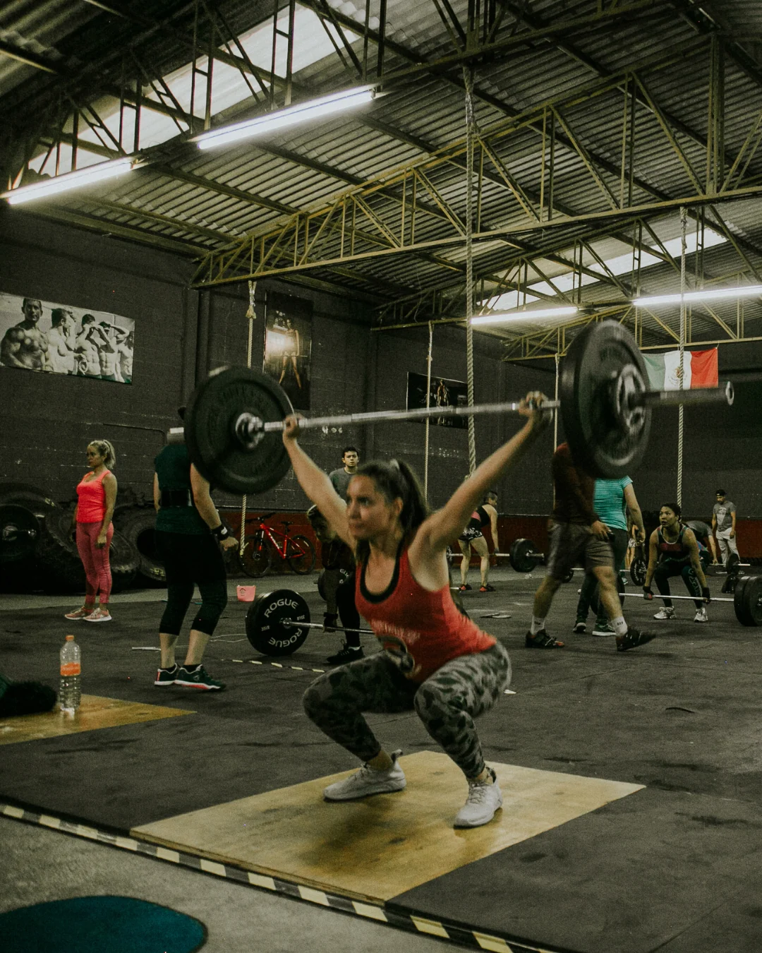Athletes practising Olympic lifting in a functional gym